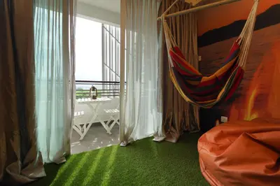 a room with a hammock in a room with a window at \u5bb6 Majestic Ipoh in Ipoh