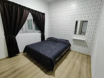 a bedroom with a bed and a mirror and a window at Family Apartment at The Quintet Cameron Highlands in Cameron Highlands
