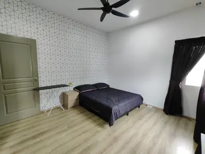 a bedroom with a bed and a ceiling fan at Family Apartment at The Quintet Cameron Highlands in Cameron Highlands