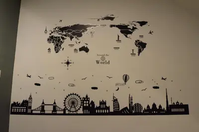 a world map on a wall with cities and helicopters at Decozy Homestay (14pax++) in Ipoh
