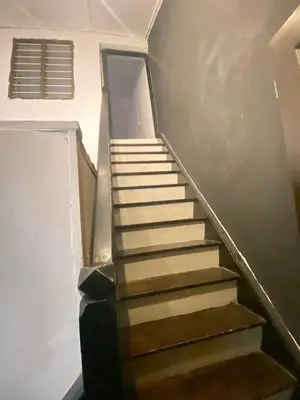 a set of stairs in a building at Hikers Sleep Port Guesthouse in Cameron Highlands