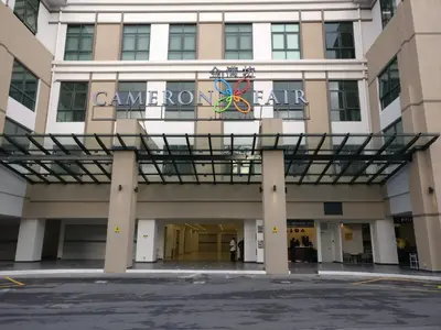 a building with a sign on the front of it at SL TR Homstay in Cameron Highlands