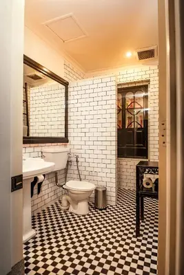 a bathroom with a toilet and a sink at Cheong Fatt Tze - The Blue Mansion in George Town