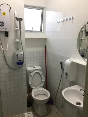 a bathroom with a toilet and a sink at Cameron Prima Apartment @ Cameron Jaya in Cameron Highlands