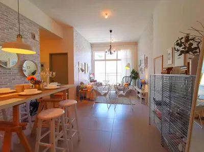 a kitchen and living room with a table and chairs at Barington Square near Night Market in Cameron Highlands