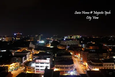 a view of a city at night with lights at H2H - Swiss Home - Majestic Ipoh in Ipoh