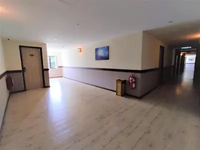 an empty room with a fire hydrant in a building at Apple Suites Hotel in Sitiawan