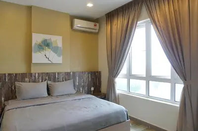 a bedroom with a bed and a large window at PM Octagon Ipoh Suites & Apartment 3 in Ipoh