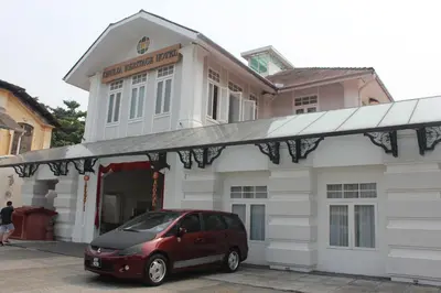 a van parked in front of a building at Chulia Heritage Hotel in George Town