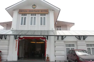 a building with a car parked in front of it at Chulia Heritage Hotel in George Town
