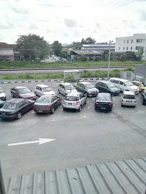 a bunch of cars parked in a parking lot at Sp Central Hotel in Sungai Petani