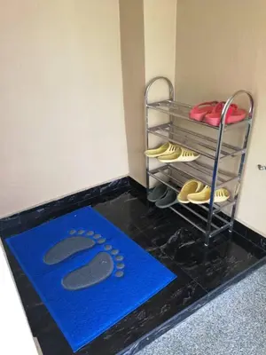 a pair of shoes on a rack in a room at Golden Hill 34 in Cameron Highlands