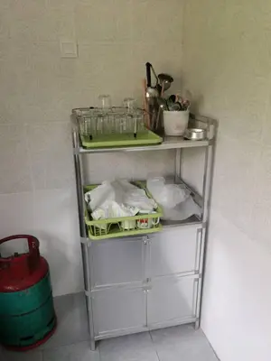 a shelf with items on it in a room at Golden Hill 34 in Cameron Highlands
