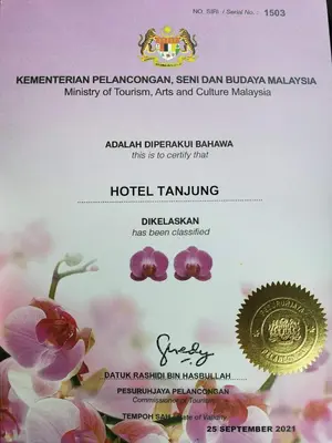 a invitation to a wedding with pink flowers at Hotel Tanjong in Tanjung Malim