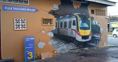 a mural of a train on the side of a building at Hotel Tanjong in Tanjung Malim