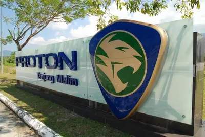 a sign for a faction faction nation on the side of a building at Hotel Tanjong in Tanjung Malim