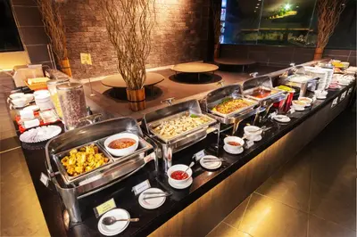 a buffet line with many different types of food at Flemington Hotel in Taiping