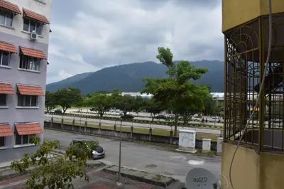 a view of a parking lot with a mountain in the background at Kelly Cozy cottage in Kampar