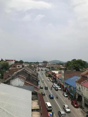 a view of a city street with cars on the road at Kangsar Hotel in Kuala Kangsar