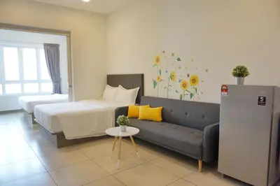 a living room with a bed and a couch in a room at PM Octagon Ipoh Suites & Apartment 2 in Ipoh
