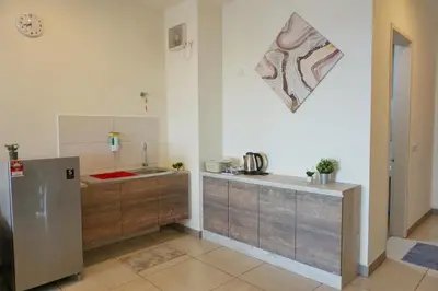 a kitchen with a sink and a counter top at PM Octagon Ipoh Suites & Apartment 2 in Ipoh