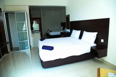 a bedroom with a large bed in a room at Marina Heights Resort in Lumut
