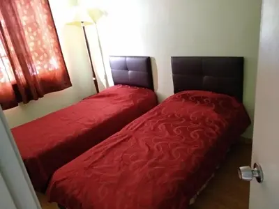 two beds sitting next to each other in a bedroom at Tenggafriz holidays in Cameron Highlands
