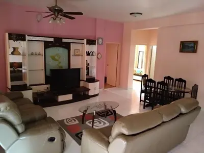 a living room with a couch and a tv at Tenggafriz holidays in Cameron Highlands