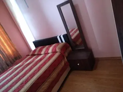 a bedroom with a bed and a mirror at Tenggafriz holidays in Cameron Highlands