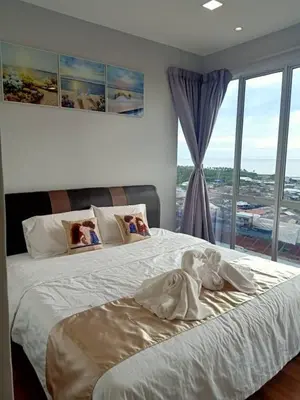 a bedroom with two baby dolls sitting on a bed at Sekinchan SeaView Homestay 134 \u9ad8\u697c\u770b\u6d77\u9633\u53f0\u6c11\u5bbf in Sekincan
