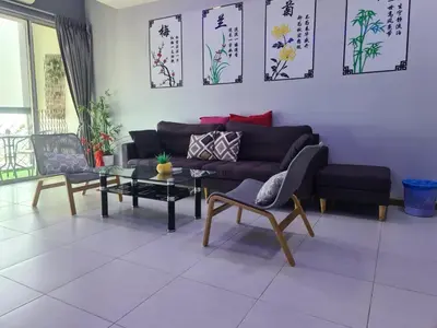a living room with a couch and a table at Sekinchan SeaView Homestay 134 \u9ad8\u697c\u770b\u6d77\u9633\u53f0\u6c11\u5bbf in Sekincan