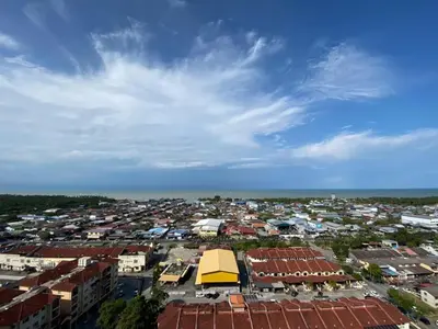 an overhead view of a city with buildings and the ocean at Sekinchan SeaView Homestay 134 \u9ad8\u697c\u770b\u6d77\u9633\u53f0\u6c11\u5bbf in Sekincan