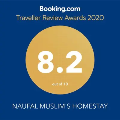 a yellow circle with the number eight and the words travel review awards at NAUFAL MUSLIM'S HOMESTAY in Cameron Highlands