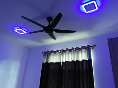 a ceiling fan with purple lights on a ceiling at NAUFAL MUSLIM'S HOMESTAY in Cameron Highlands