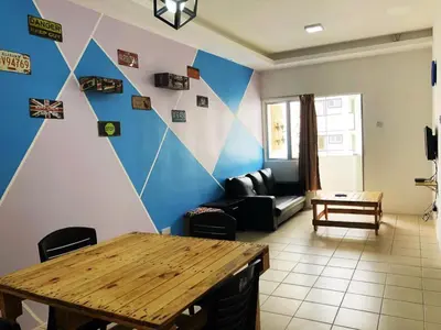 a living room with a table and a couch at CH Homestay in Cameron Highlands