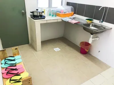 a small kitchen with a sink and a counter at CH Homestay in Cameron Highlands