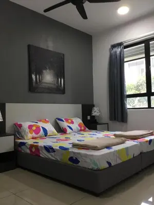a bedroom with a bed and a painting on the wall at The Meadow Park in Kampar