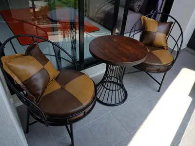 two chairs and a table and a table and chairs at Oasis Condominium in Ipoh