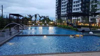 a large swimming pool with a water slide at Oasis Condominium in Ipoh