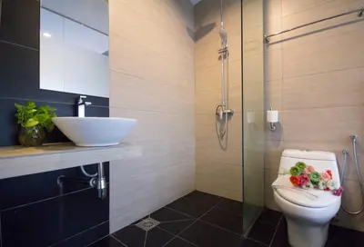 a bathroom with a toilet and a sink at Chariton Hotel Ipoh in Ipoh