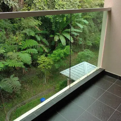 a balcony with a view of a forest at Azizi&Yati Muslim Homestay Cameron Highlands in Cameron Highlands
