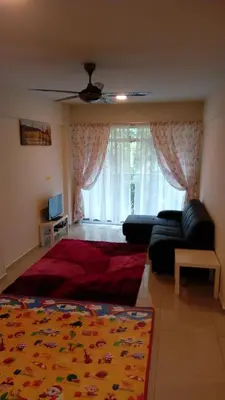 a bedroom with a bed and a couch and a window at Azizi&Yati Muslim Homestay Cameron Highlands in Cameron Highlands