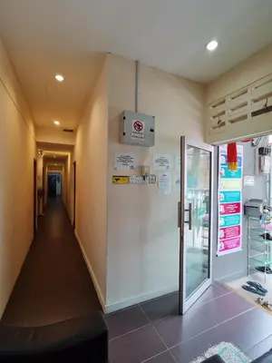 a hallway in a building with a door and a corridor at StarVilla Kinta River Front Medan Istana in Ipoh