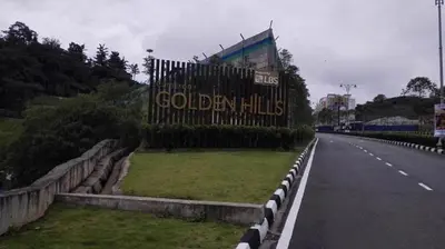 a sign that reads golden hills on the side of a road at Mariana Barrington Square Goldenhills Pasar Malam Cameron Highlands in Cameron Highlands