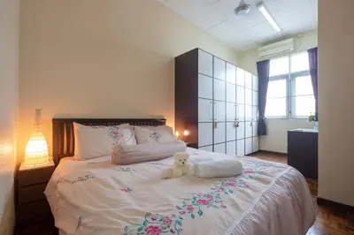 a white teddy bear sitting on top of a bed at •Lovely Home•11Pax+4Bedrooms+Themed•Bukit Mertajam in Bukit Mertajam