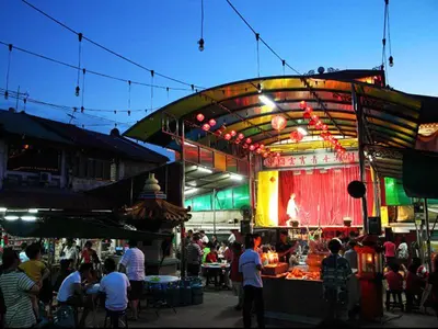 a crowd of people standing around a market with a stage at •Lovely Home•11Pax+4Bedrooms+Themed•Bukit Mertajam in Bukit Mertajam