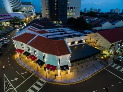 an overhead view of a building in a city at night at Magazine Vista Hotel Managed by The Ascott Limited in George Town