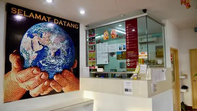 a store with a sign that says slanant danish pharmacy at Abby by the river in Ipoh