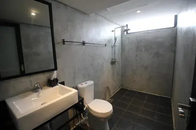 a bathroom with a sink and a toilet and a shower at 68 Boutique Hotel in Sitiawan