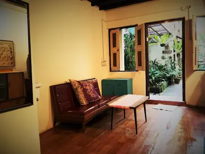 a living room with a couch and a coffee table at MoonTree47 in George Town